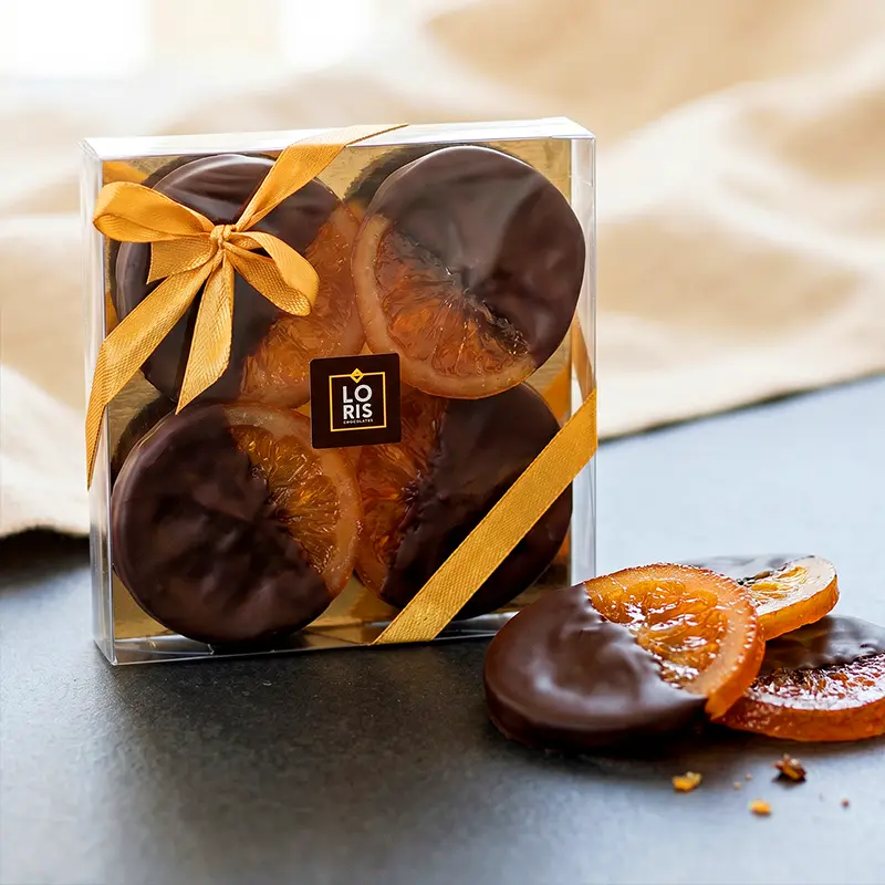 Rodajas de naranja confitada en chocolate negro 70% cacao